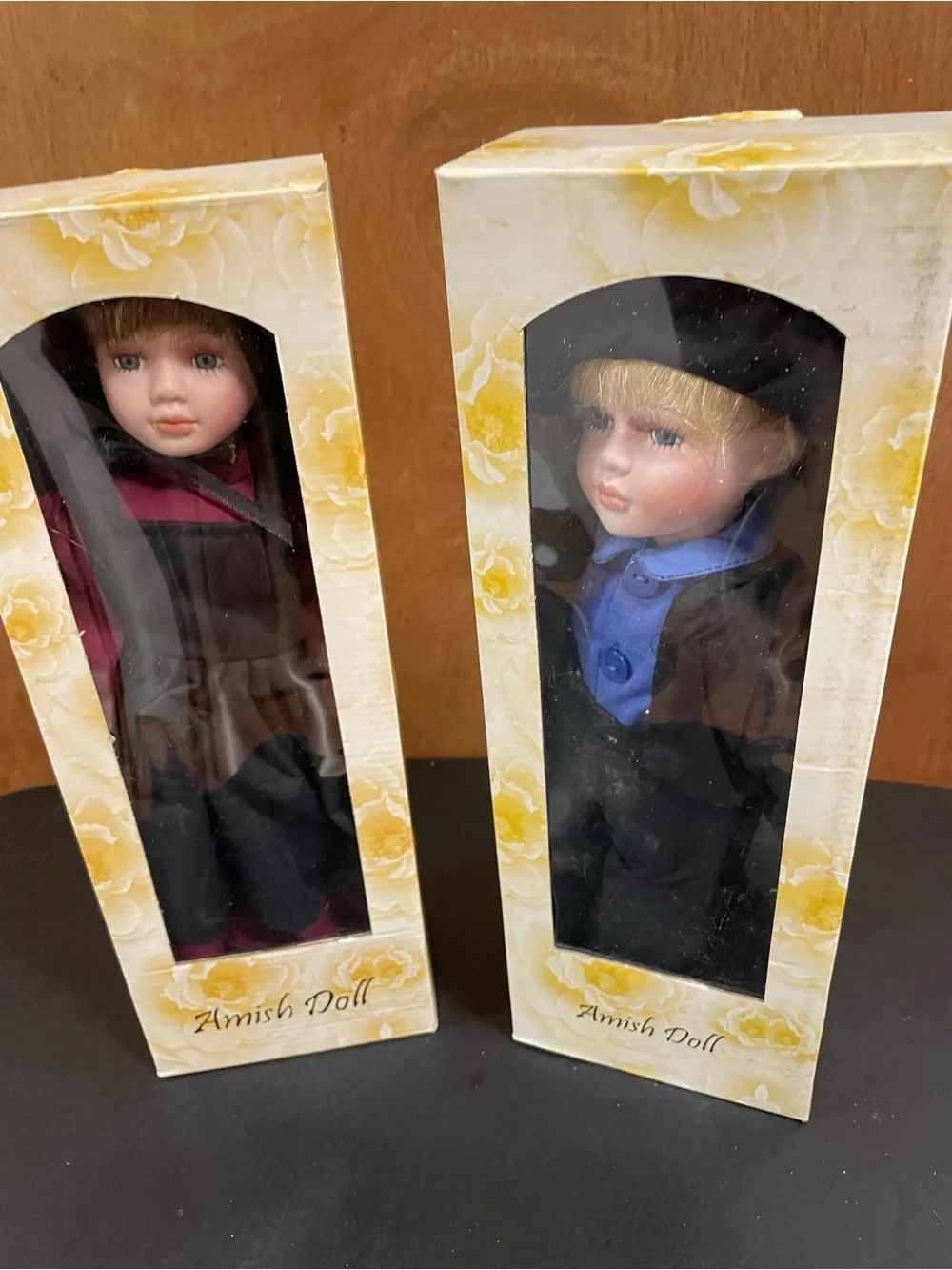 Porcelain Boy and Girl Dolls in Black, Blue and Burgundy Clothing